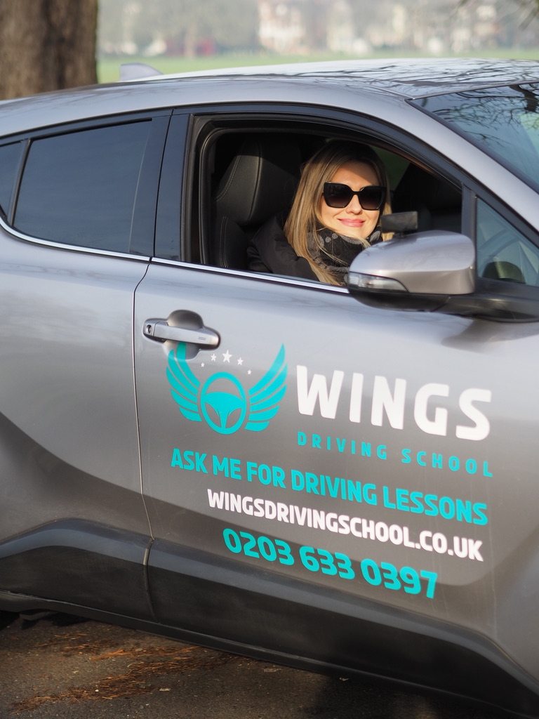 Driver in a Wings Driving School car
